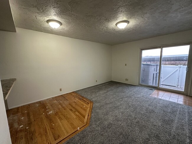 Building Photo - Spacious, three level, 4 Bed 2.5 bath Townhome in Ammon right behind the Walmart on Hitt.