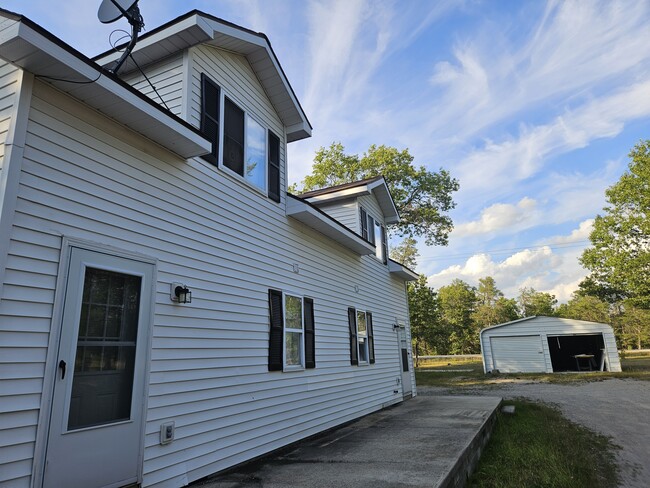 The side of the building you can see the front and rear apartment. - 4304 Kateri Ln