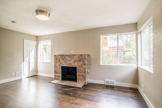 Living area with fireplace - 1460 Elm Street Townhome
