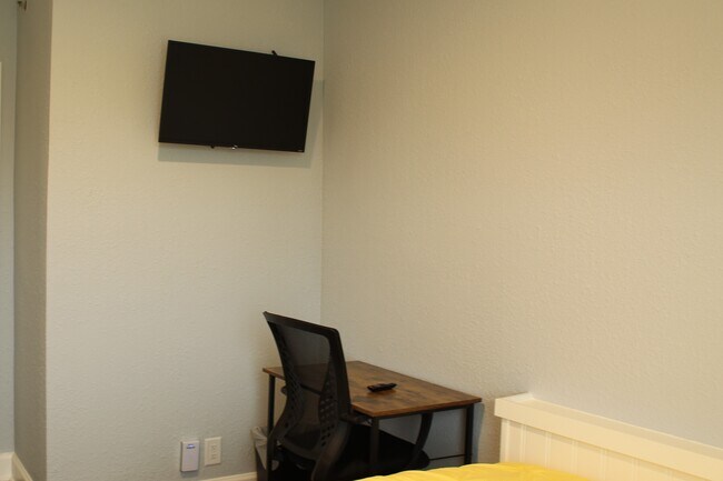 Unit 19 has hardwood floors and natural light. It includes a desk, chair and smart tv, as well as your own private wifi. - 3811 Gallatin Pike