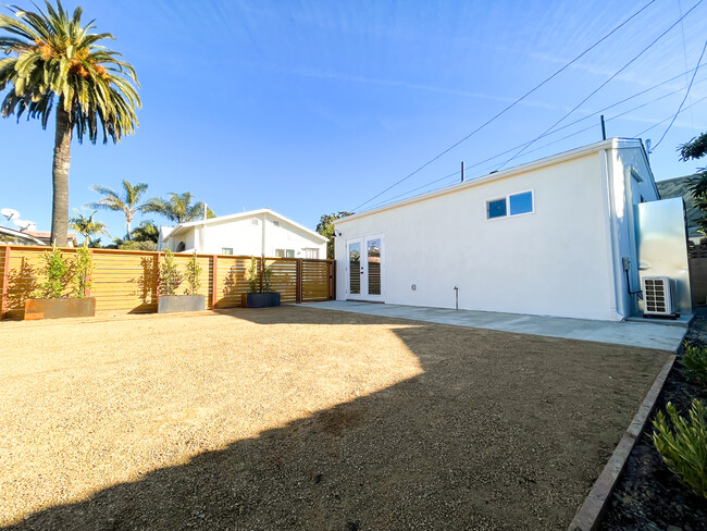 Private yard looking toward the entrance of the house - 166 Comstock Dr