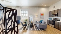 Located at 4514 Lyons Ave in Houston, TX, this one-bedroom, one-bathroom unit offers a well-designed single-floor layout that maximizes every square foot. Light wood-style flooring runs throughout, complementing the bright, neutral color palette that defines the space.

The open-concept living area flows seamlessly into the combined kitchen and dining room. The kitchen is outfitted with dark-toned cabinetry, light countertops, and a full suite of stainless steel appliances, including a range, over-the-range microwave, dishwasher, and refrigerator. A dedicated dining area sits adjacent, making everyday living efficient and connected.

The living room benefits from large windows that invite natural light, with exposed ductwork along the ceiling adding an industrial character to the space. Recessed lighting throughout ensures the interior remains well-lit at all hours.

The generously sized primary bedroom features elevated ceilings, a ceiling fan, light wood flooring, and a closet with louvered doors. The room provides ample space for furnishings while maintaining an open, airy feel.

The bathroom is clean and contemporary, featuring a single vanity with a marble-style countertop, a large mirror, and a tiled tub/shower combination. A dedicated laundry area rounds out the unit's practical amenities.