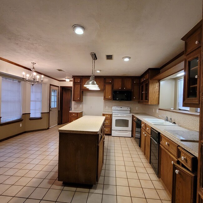 Kitchen w island and loads of cabinets - 20433 Kermier Rd