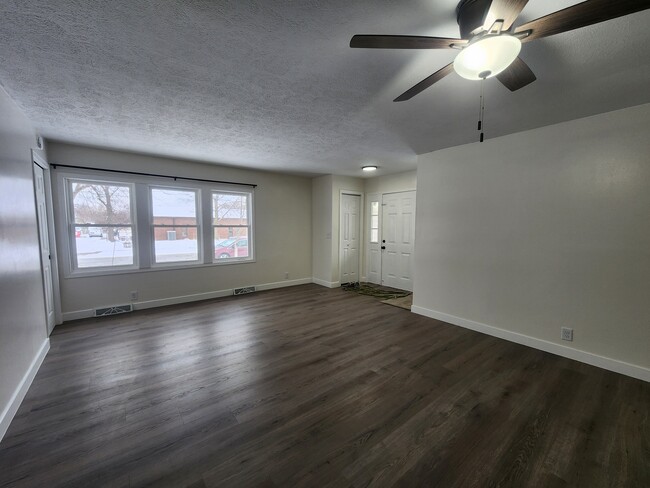 Living room including front door - 905 Woodmere Dr