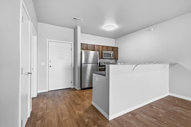 Elevate your living at North Highlands Apartments, featuring modern finishes and an open layout that maximizes comfort. Enjoy upgraded appliances and stylish design in every corner. Explore your new home today! - North Highlands Apartments and Villas