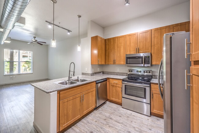 Create meals and memories in your modern kitchen. - Lofts at 7100
