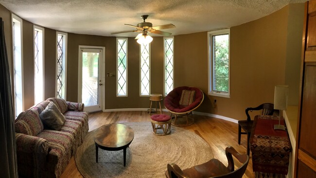 Living room fully furnished, ceiling fan, hardwood floors, lots of natural light - 4279 Janes Ln
