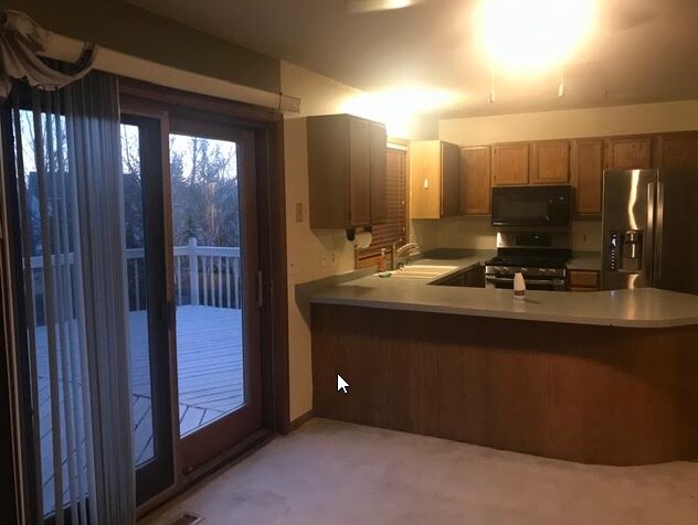 kitchen showing sliding doors to deck - 18949 Barrington Dr