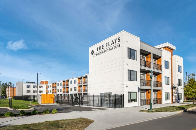 Building Photo - The Flats at Southside Gardens
