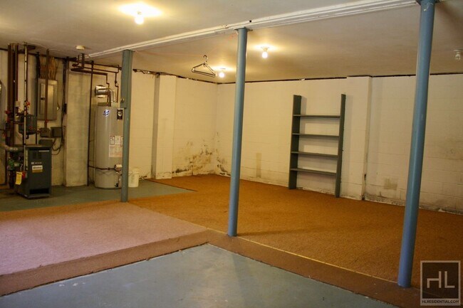 Building Photo - 3.5BR 1.5BA Triplex w/ Elevated Wood Deck, Vegetable Garden, Private Parking, Waterfall & Finishe...
