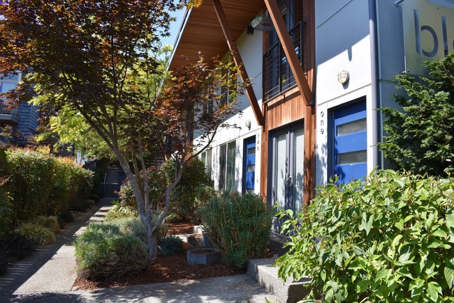 Low maintenance building with mature landscaping - Bleu Apartments