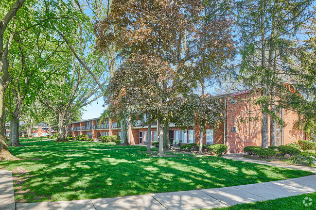 Green space in front of Garden Arms Apartment building - Garden Arms of Westgate