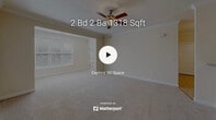 This single-story home in Knightdale, NC offers a well-organized layout with a neutral color palette and consistent finishes throughout. The entry area features warm-toned tile flooring and crown molding, anchored by a chandelier that adds a welcoming touch. The open living area is carpeted and connects directly to a pass-through kitchen, which is defined by decorative columns and visible from the main living space. A ceiling fan provides comfort in the living area.

The kitchen is equipped with rich cherry-toned cabinetry, granite countertops, a double sink, and black appliances including a refrigerator and range. Tile flooring carries through the kitchen and into the dining area, which also features crown molding and a chandelier overhead.

The bedrooms are carpeted and receive natural light through windows with views of surrounding greenery. One bedroom includes a pendant light fixture, while another benefits from a ceiling fan and a recessed window nook. Bathrooms are finished with granite vanity tops, cherry cabinetry, and tile flooring, with tub-shower combinations.

A dedicated laundry room includes washer and dryer hookups, a gas connection, and wire shelving above for storage.
