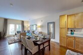 Located at 4375 Regency Dr in High Point, NC, this thoughtfully designed 2-bedroom, 2-bathroom single-floor residence offers a comfortable and functional layout across a generously sized floor plan. The open-concept living and dining area serves as the heart of the home, showcasing rich stained concrete floors that flow throughout the space. Large windows allow natural light to fill the room, creating a warm and inviting ambiance. The adjoining kitchen features warm-toned wood cabinetry extending to the ceiling, stainless steel appliances including a refrigerator and dishwasher, and granite-style countertops.

The spacious primary bedroom comfortably accommodates a king-size bed and benefits from natural light through a large window, a ceiling fan, and access to a generously sized walk-in closet with wire shelving systems. The second bedroom is equally well-proportioned and versatile. Both bathrooms are finished with matching wood cabinetry and offer tub-shower combinations. Additional highlights include three closets throughout the home and a dedicated laundry area for added convenience. The overall aesthetic is clean and neutral, providing an ideal canvas for personalization.