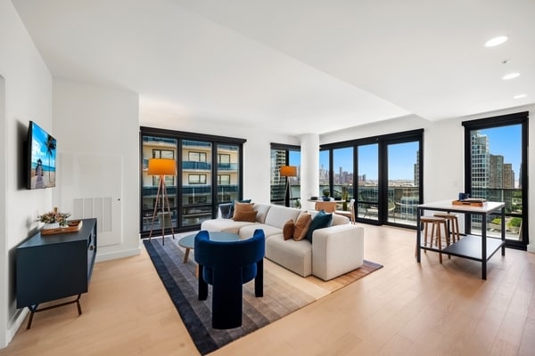 Residences boast spacious layouts with floor-to-ceiling windows. - Bisby at Newport