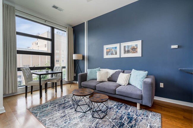 Floor to ceiling windows for lots of natural light, but close the black-out curtains for good rest. - 525 E 6th Street