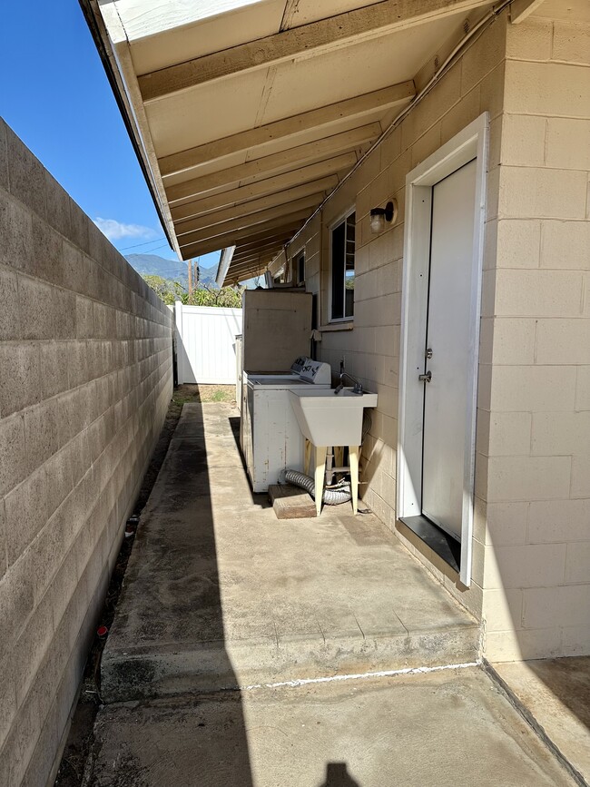 Laundry units & outside storage, back door - 200 Lono Ave