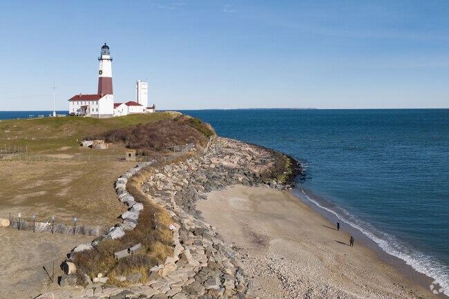 The coastline below the Montauk Lighthouse offers sweeping Atlantic views and access to iconic beaches favored by swimmers, surfers, and sightseers.