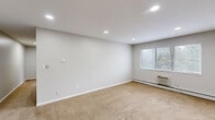 Located at 4117 Gratiot Ave in Fort Gratiot, Michigan, this two-bedroom, one-bathroom single-floor residence offers a clean, functional layout designed for comfortable everyday living. The floor plan flows from a welcoming entrance through a hallway connecting all principal areas of the home.

The living room is generously proportioned, featuring neutral carpet, recessed lighting, bright white walls, and a window that allows natural light to fill the space. A wall-mounted air conditioning unit and baseboard heating ensure year-round comfort. Both bedrooms follow a similar design, with plush carpeting, baseboard heating, and windows overlooking the outdoors. The primary bedroom is notably spacious and includes a wide louvered bi-fold closet. Altogether, the home provides four closets, offering ample storage throughout.

The combined kitchen and dining area is well-equipped with warm wood cabinetry, a white tile backsplash, a double-basin sink, and white appliances including a gas range and refrigerator. Tile flooring adds durability to the space, and a large window in the dining area brings in additional natural light.

The bathroom is clean and bright, featuring a full tub and shower surround with built-in shelving and a window for ventilation. Consistent neutral tones and simple finishes give the entire residence a cohesive, move-in-ready aesthetic.