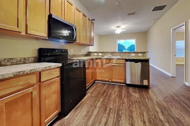 Building Photo - 7093 Rapid River Dr W