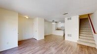 Located at 1167 Saint Matthew Place in Concord, CA, this two-story, 2-bedroom, 2-bathroom home offers a well-organized layout spread evenly across two floors. The main level features a bright, open living room with light hardwood-style flooring, neutral walls, and a ceiling fan, flowing seamlessly into the kitchen. Large sliding glass doors flood the space with natural light and provide direct access to an outdoor patio area. The kitchen is well-appointed with white cabinetry, granite-style countertops, a peninsula with a stainless steel sink, and white appliances including a range, microwave, refrigerator, and dishwasher. Upstairs, two carpeted bedrooms offer comfortable retreats, including a generously sized primary bedroom. One bathroom features a stacked in-unit washer and dryer alongside a vanity with ample cabinet storage, while a separate tiled shower-tub combo provides added convenience. Each floor is thoughtfully laid out with closets, a hallway, and dedicated entry, maximizing the functional use of space throughout. The clean, neutral palette and consistent finishes give the home a cohesive, move-in-ready feel.