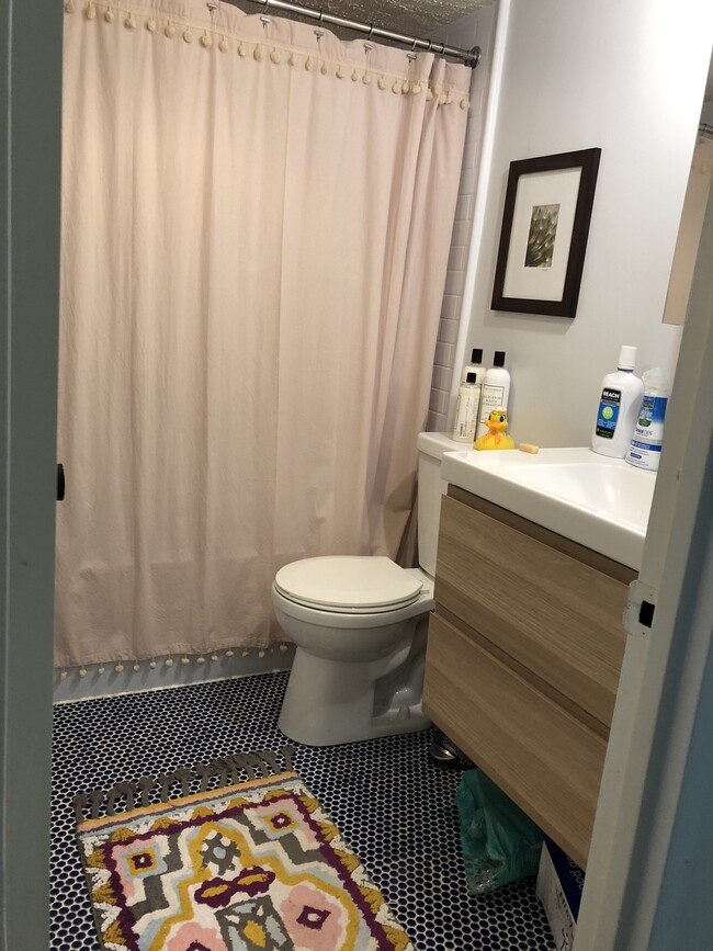 Newly redone bathroom with drawers below sink - 300 M St SW