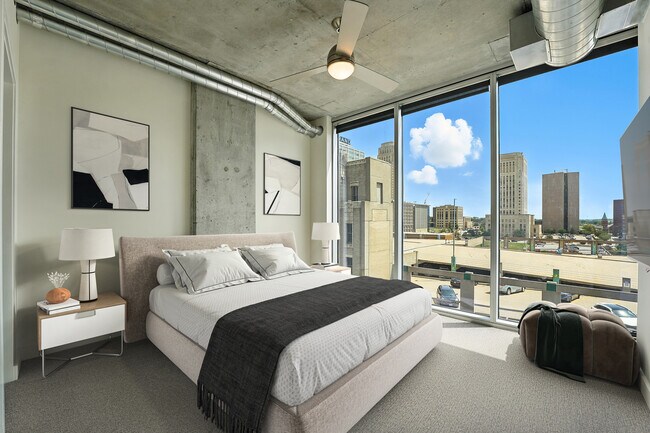 The bedroom of the 1B Den A3 floor plan at One Light Luxury Apartments - One Light Luxury Apartments
