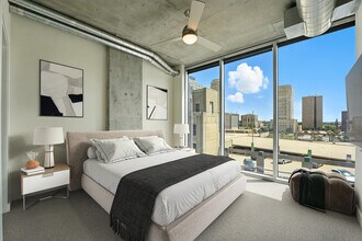 The bedroom of the 1B Den A3 floor plan at One Light Luxury Apartments - One Light Luxury Apartments