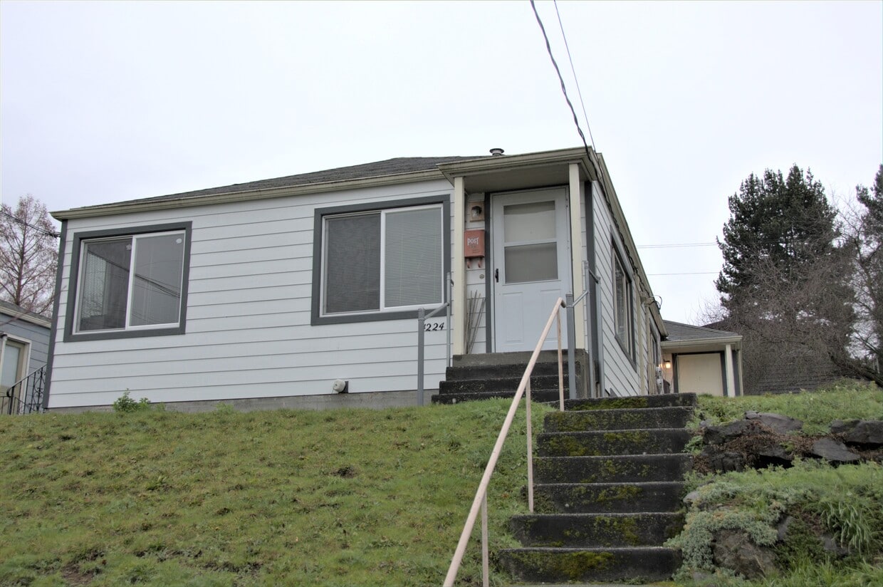 Front of building. Steps up to the duplex. - 4222 4th Ave NW