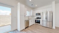 Located at 4288 W Denali Ln in Phoenix, AZ, this two-story home offers 3 bedrooms, 4 bathrooms, and a thoughtfully designed layout spread across two floors. The main level features an open-concept living room and kitchen, connected by a bright hallway with light wood-look flooring that flows throughout. The kitchen is outfitted with white shaker cabinetry, a subway tile backsplash, stainless steel appliances including a refrigerator, range, microwave, and dishwasher, and a window over the sink for natural light. The living area is well-lit with recessed lighting and a ceiling fan. An attached garage with an automatic opener provides convenient parking and storage. Upstairs, the spacious primary bedroom includes a generous walk-in closet, while additional bedrooms feature closets and natural light from windows with blinds. Four full bathrooms serve the home, including one with a glass-enclosed walk-in shower with tile surround. A dedicated laundry area houses a full-size washer and dryer. Throughout the home, clean white walls, modern finishes, and consistent flooring create a cohesive, contemporary aesthetic well-suited to the Phoenix lifestyle.