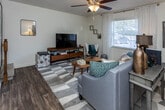 Located at 8608 Eagle Pointe Dr in Knoxville, Tennessee, this two-floor home offers a well-organized and functional layout across its multiple levels. The main living area welcomes residents with durable wood-style flooring, a ceiling fan, and generous natural light filtering through slatted blinds. A console table and open sight lines give the space a connected, airy feel, with a staircase leading to the upper level.

The galley-style kitchen is efficiently designed with warm wood cabinetry lining both walls, ample counter space, and a full suite of appliances including an electric range, built-in microwave, and dishwasher. A door at the end of the kitchen provides convenient exterior access and additional natural light.

The bedrooms are carpeted and generously sized, each featuring ceiling fans and natural light from well-placed windows. Closet space is notably abundant, with multiple walk-in and reach-in closets visible in the upper-level rooms. The bathrooms are clean and functional, with wood-toned vanities, wide mirrors, and updated lighting fixtures.

A dedicated in-unit laundry room with full-size washer and dryer hookups adds practical convenience. Throughout the home, the neutral color palette and consistent finishes create a cohesive, comfortable living environment well-suited for everyday life in the Eagle Pointe community.
