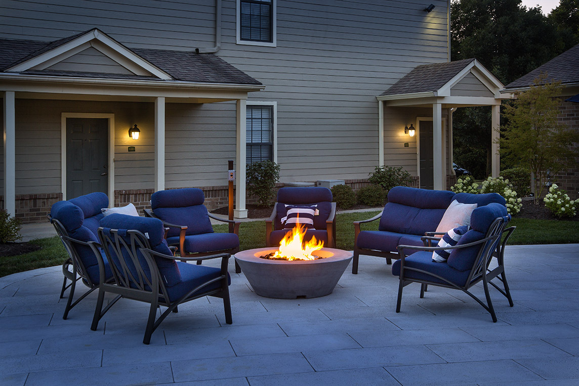 Outdoor fire pit and lounge seating - Park Place Apartments