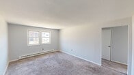 Located at 1 Off Lariviere Avenue in Palmer, MA, Unit 33 is a practical and well-organized three-bedroom, one-bathroom residence contained on a single floor. The layout efficiently accommodates all living spaces, connected by a central hallway that provides easy access throughout the unit.

The kitchen is a functional highlight, featuring white cabinetry extending to the ceiling for ample storage, blue-gray laminate countertops, a double stainless steel sink, and light wood-look vinyl flooring. It is equipped with a stainless steel refrigerator and an electric range, making it move-in ready.

Each of the three bedrooms is finished with soft gray carpet and painted in neutral light gray tones, creating a calm and cohesive atmosphere. The generously sized primary bedroom features a pair of windows that invite natural light and views of the surrounding neighborhood, along with baseboard heating for year-round comfort. One of the secondary bedrooms includes a mirrored sliding-door closet, adding both storage and a sense of depth to the room. A third bedroom with its own window and ceiling light fixture rounds out the sleeping quarters.

The bathroom features a full-size tub and shower combination with clean white surroundings. Two closets provide additional storage throughout the unit. Textured ceilings are consistent across the space, and baseboard heating is present in all rooms.