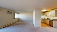 Located at 3134 Greenfield Rd in Royal Oak, Michigan, this one-bedroom, one-bathroom residence offers a comfortable and functional single-floor layout. The expansive living room is carpeted and bathed in natural light from large windows, with baseboard heating and a wall-mounted air conditioning unit ensuring year-round comfort. The space flows seamlessly into a dedicated dining area, creating an open and inviting atmosphere.

The kitchen features light maple cabinetry, granite-style countertops, hardwood-style flooring, a full suite of appliances including a refrigerator, electric range, and dishwasher, and a pendant light fixture overhead. An adjacent pantry provides convenient additional storage.

The well-sized bedroom is carpeted and includes its own window for natural light, baseboard heating, and a ventilation unit. Three closets throughout the unit — including generously shelved options — offer excellent storage capacity. The bathroom is finished with classic white subway tile surrounding the tub and shower, a granite-top vanity, and tile flooring, lending a clean, timeless aesthetic.

A private balcony extends the living space outdoors, and a hallway ties the layout together efficiently. This residence combines practical design with comfortable living in a well-connected Royal Oak location.