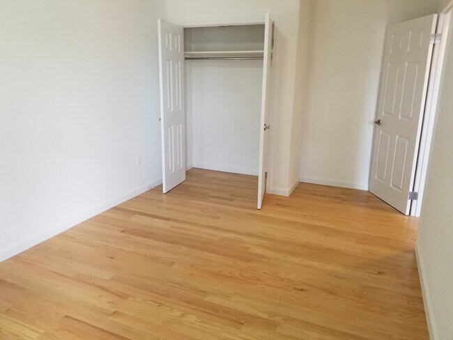 Large back room showing closetcan fit king size bed, dresser, desk - 1044 Faile St