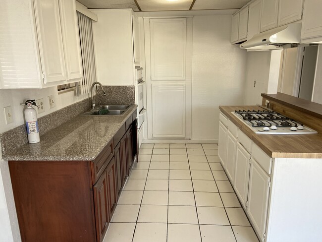 Kitchen with new granite countertop - 18410 Desidia St