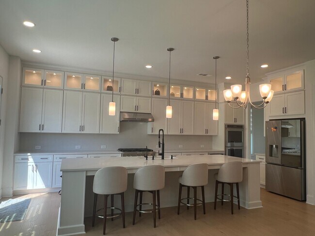 luxury kitchen with to the ceiling cabinets - 6490 Pond View Dr