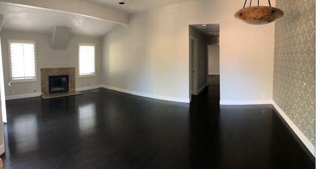 Fireplace; hardwood flooring throughout; alabaster dining chandelier in dining room. - 97 Corsica Dr
