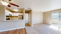 Located at 2355 Meadow Way in Santa Rosa, CA, this one-bedroom, one-bathroom residence offers a well-organized single-floor layout designed for comfortable everyday living. The open-concept main area seamlessly connects the living room and dining space, finished with neutral-toned carpet and wood-style flooring that define each zone. Natural light streams through vertical-blind windows, brightening the living area and enhancing its welcoming ambiance. A ceiling fan adds both comfort and character to the space.

The kitchen is positioned at the heart of the home with a peninsula-style counter that opens to the living and dining area. It features white shaker-style cabinetry, light stone countertops, wood-look flooring, and a full suite of stainless steel appliances including a refrigerator, electric range, over-the-range microwave, and dishwasher.

The generously sized bedroom offers plush carpeting, a ceiling fan with light fixture, and a window with vertical blinds for natural light and privacy. Two closets provide ample storage. The bathroom is neatly appointed with a white vanity, light stone countertop, a three-bulb vanity light, framed mirror, and wood-style flooring. Clean white trim and warm beige walls carry throughout, giving the entire residence a cohesive, move-in-ready aesthetic.