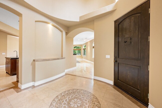 Building Photo - Stunning custom home in a highly sought-af...