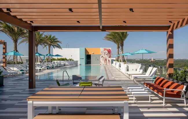 Entertain in style with our pool-side grilling area - Core Link at Douglas Apartments