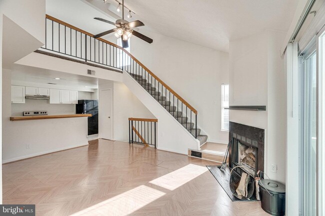 Building Photo - This two-bedroom, two-bathroom condo becko...