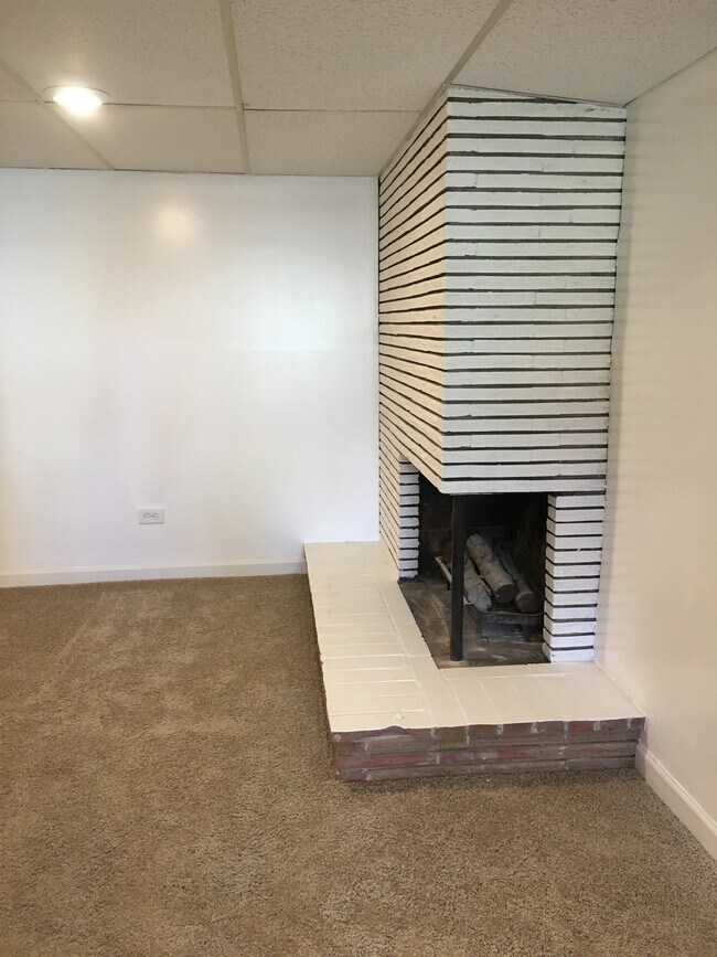 Large living room with wood burning fireplace - 7322 28th Ave SW