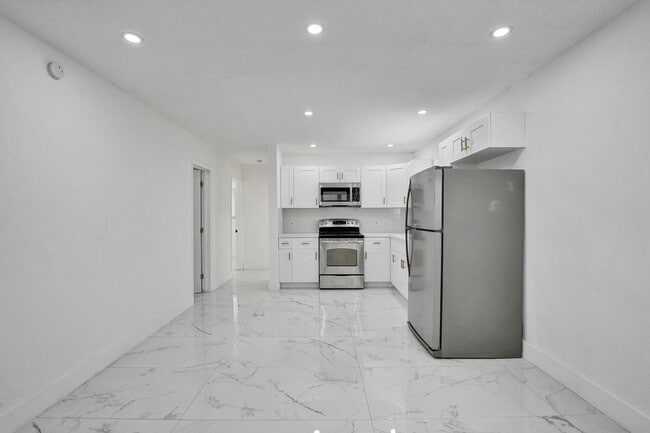 unit 4 kitchen straight ahead - 105 NW 14th Way
