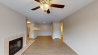 This single-story residence in Jackson, Tennessee offers a thoughtfully designed layout that maximizes comfort and functionality. The open living area serves as the heart of the home, featuring light wood-style flooring, a textured ceiling, and a ceiling fan overhead. A tile-surround fireplace anchors the living space, adding warmth and character. Natural light filters in through a large multi-pane window, enhancing the bright, neutral color palette throughout.

The kitchen is efficiently arranged in a galley-style configuration with a peninsula that opens to the living area. White shaker-style cabinetry lines both walls, complemented by light quartz countertops, a double-basin sink, and a full suite of stainless steel appliances including a refrigerator, range, microwave, and dishwasher. The wood-style flooring continues seamlessly into this space.

The bedroom is a comfortable retreat with plush carpeting, a window with outdoor views, and direct access to the hallway leading to the full bathroom. The bathroom is clean and functional, featuring tile flooring, a tub-shower combination with white tile surround, and a tall storage cabinet for added convenience.
