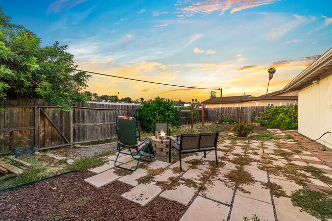 Outdoor space featuring a cozy fire pit, perfect for gathering and enjoying starry nights! - 6090 Rock St