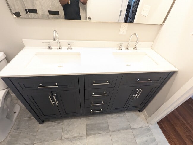 Refreshed bathroom with double vanity - 2024 N Calvert St