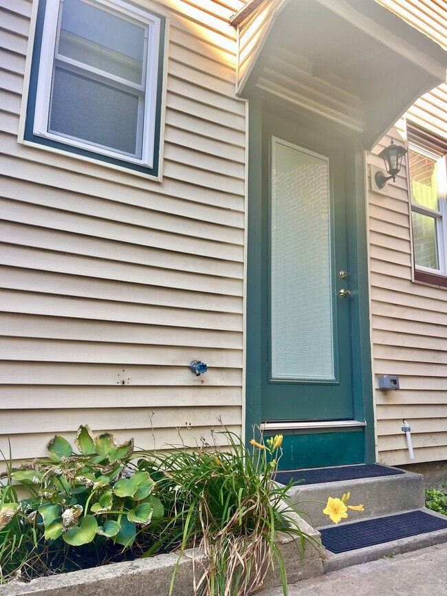 sweet garden and flowers greet you - 352 S Main St