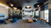 This thoughtfully designed single-floor amenity space combines striking aesthetics with functional versatility. The entrance welcomes visitors with large floor-to-ceiling glass doors, tile flooring, and sage green accent walls, setting a modern tone from the outset. A private meeting room with warm wood paneling and frosted glass sliding doors is conveniently located just off the entry.

The central lounge is an expansive, open gathering area anchored by a dramatic large-scale floral mural that commands attention. Sculptural pendant lights hang from a dark ceiling, casting a warm, ambient glow over an eclectic mix of navy blue lounge chairs, a cognac leather bench, and contemporary accent tables. A cozy seating alcove nearby features a sleek gas fireplace, additional lounge seating, and textured wall paneling beneath warm cove lighting.

A bright corner nook bathed in natural light through oversized windows offers a casual lounge setup with a leather sofa and game table. Adjacent to the main lounge, a dining area provides wooden tables with banquette and chair seating beneath pendant lights, ideal for informal gatherings.

The kitchenette is outfitted with dark countertops, a stainless steel sink, upper cabinetry, and a textured tile backsplash. The fitness center rounds out the space with a full array of cardio and strength equipment, a decorative botanical mural, exposed concrete columns, and generous natural light.