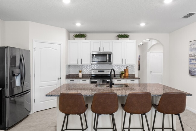 Building Photo - 4BR Under $2,300/mo | Tesla Charger | 15 Min to Lake Nona
